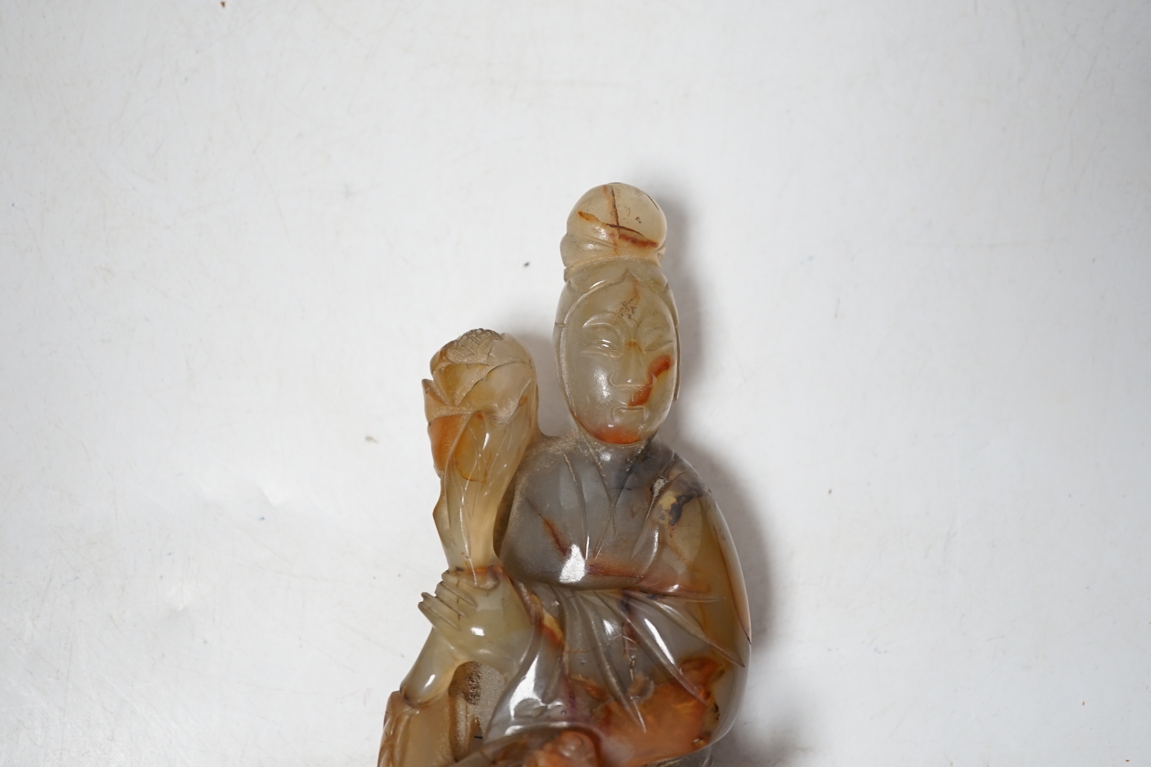 A Chinese carved agate group of Guanyin with a phoenix, 19th century, 17cm high